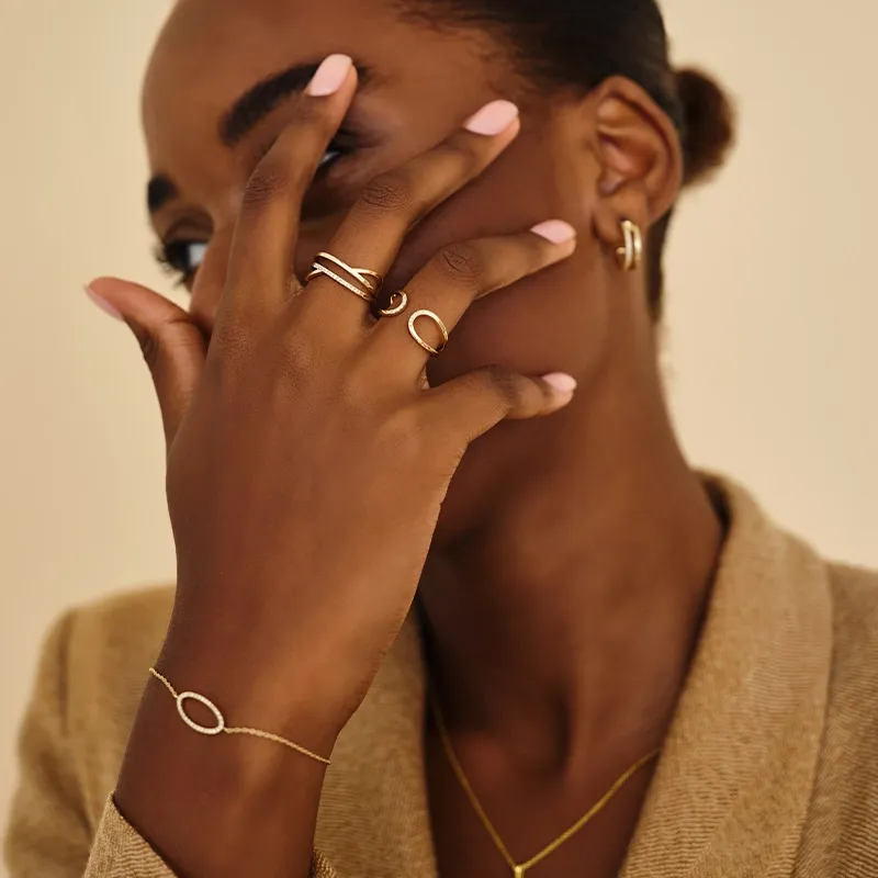 14 carat gold jewelry on girl with blazer