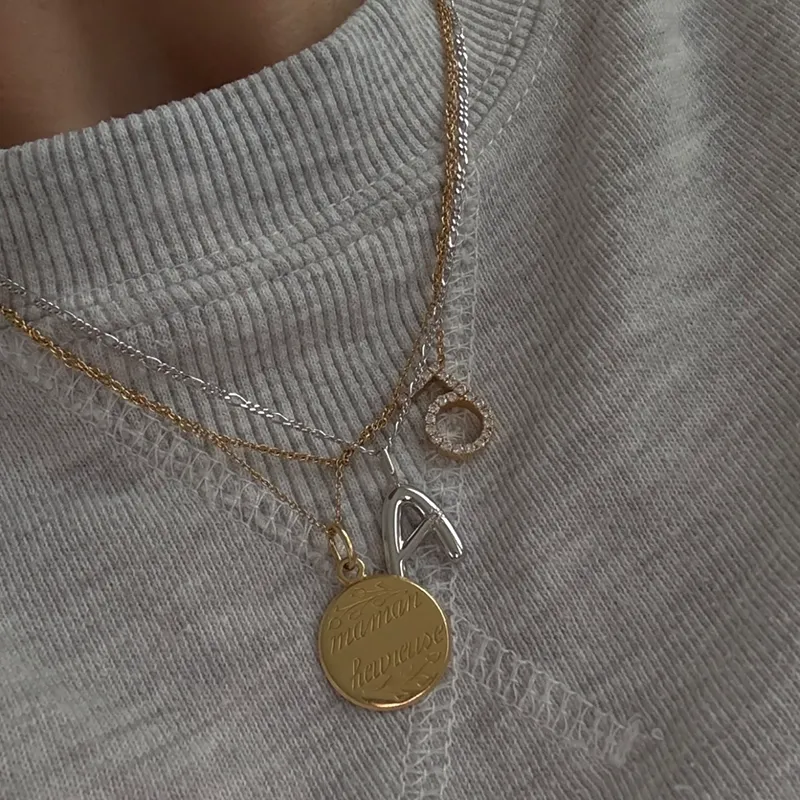 a silver initial charm necklace