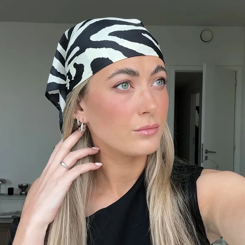 silver hoop earrings on blond woman