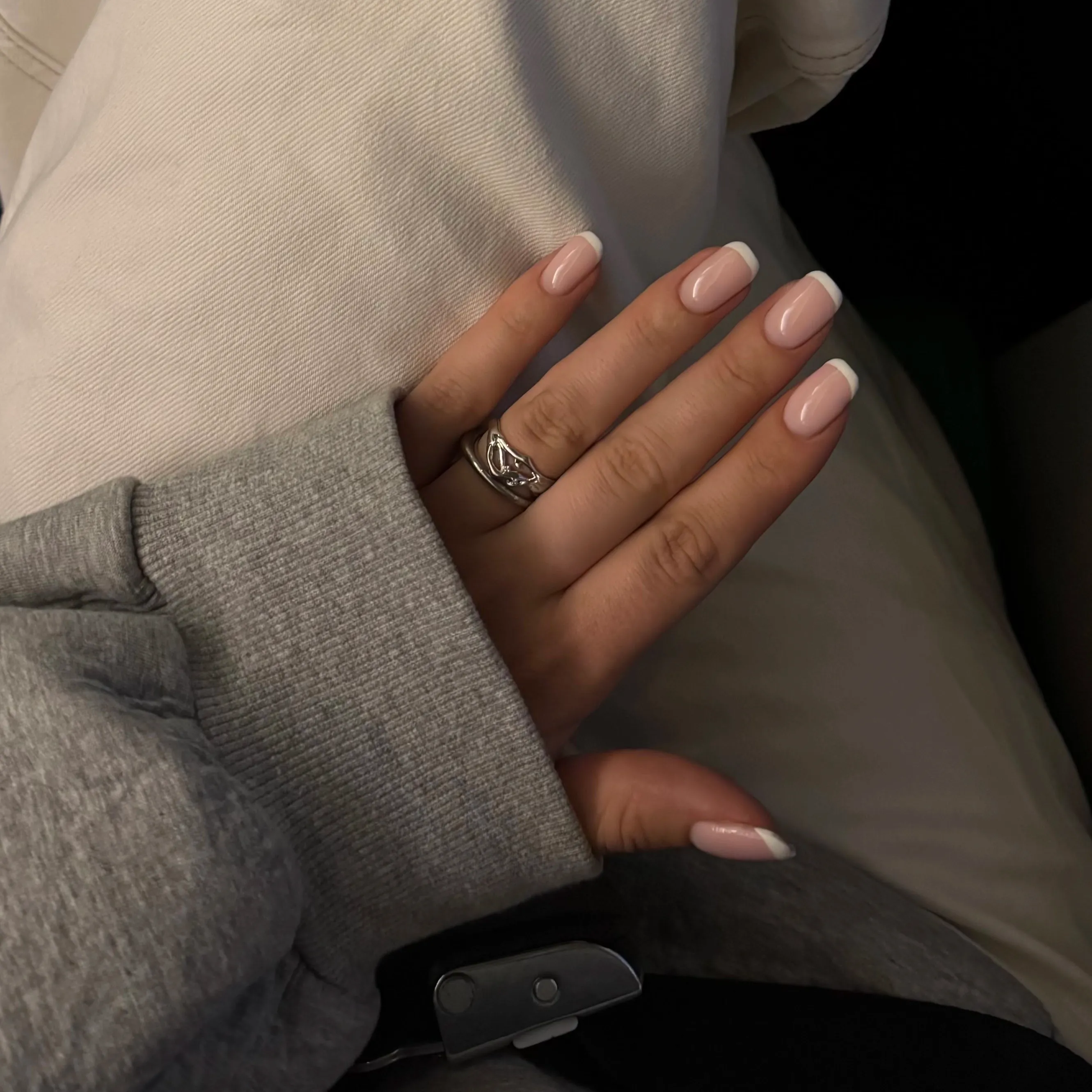 twiggy silver ring on hand with grey sweater
